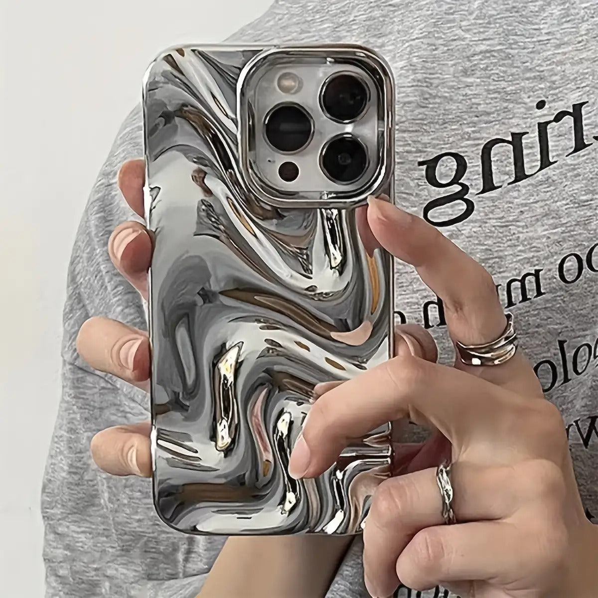 A Silver-Plated 3D Personalized Water Wave Pattern Phone Case Suitable for Iphone 11, Iphone 13, Iphone 14, Iphone 14 Pro Max, Iphone 15, Iphone 15 Pro, Iphone 15 Pro Max, Iphone 16, Iphone 16 Pro, Iphone 16 Pro, And Iphone 16 Pro Max.